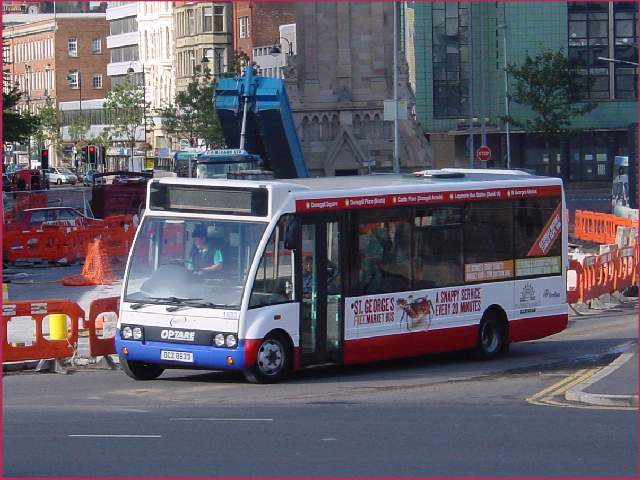 Optare Solo 1833 - with side and rear advert - Belfast Sept 2004